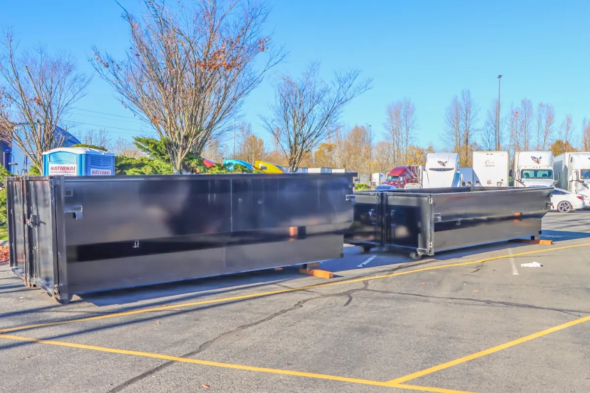 Professional dumpster rental service with roll-off container on residential driveway in Willows